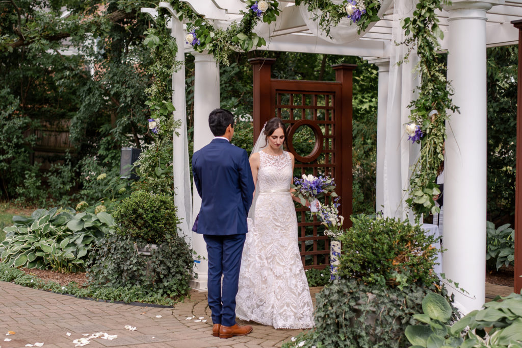 photo of bride circling around groom during wedding ceremony