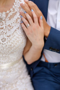 photo of bride and grooms rings