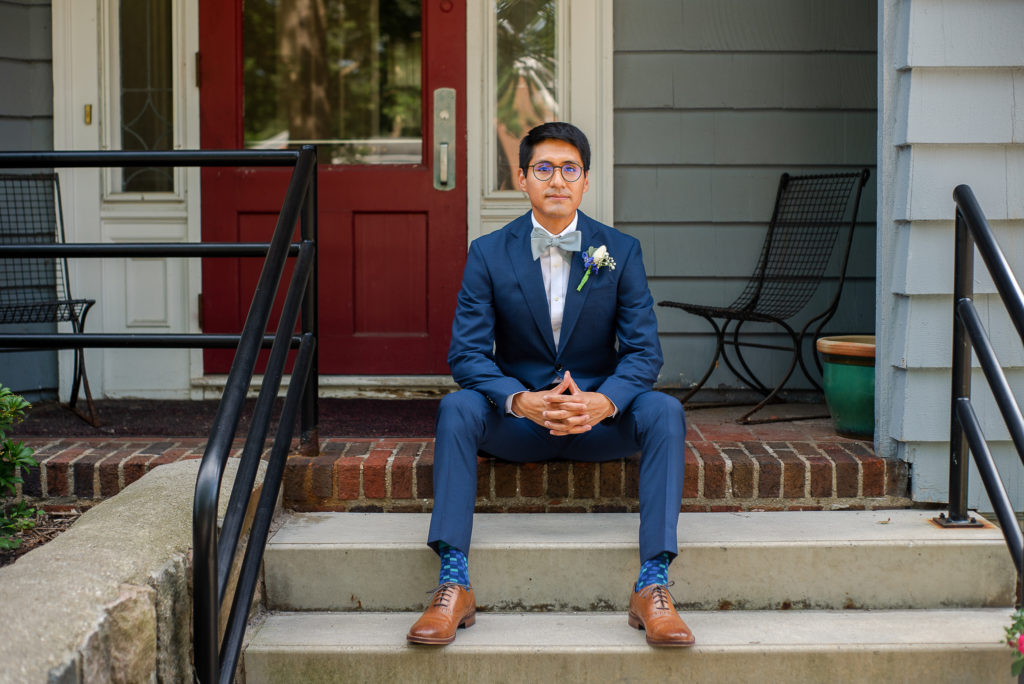 photo of groom sitting on wedding day