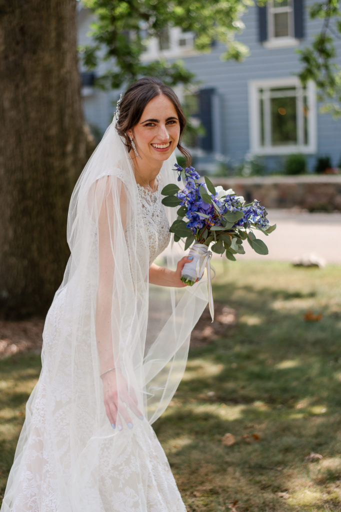 natural portrait of bride laughing on wedding day