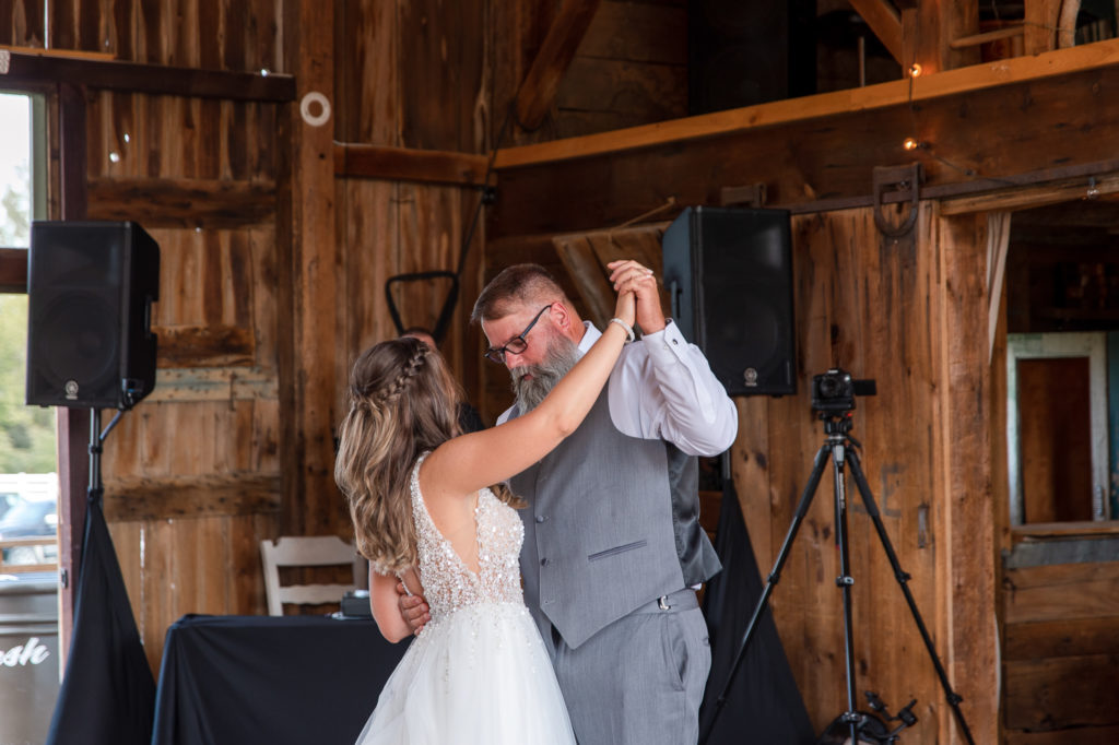 photo of bride dancing with dad at wedding reception