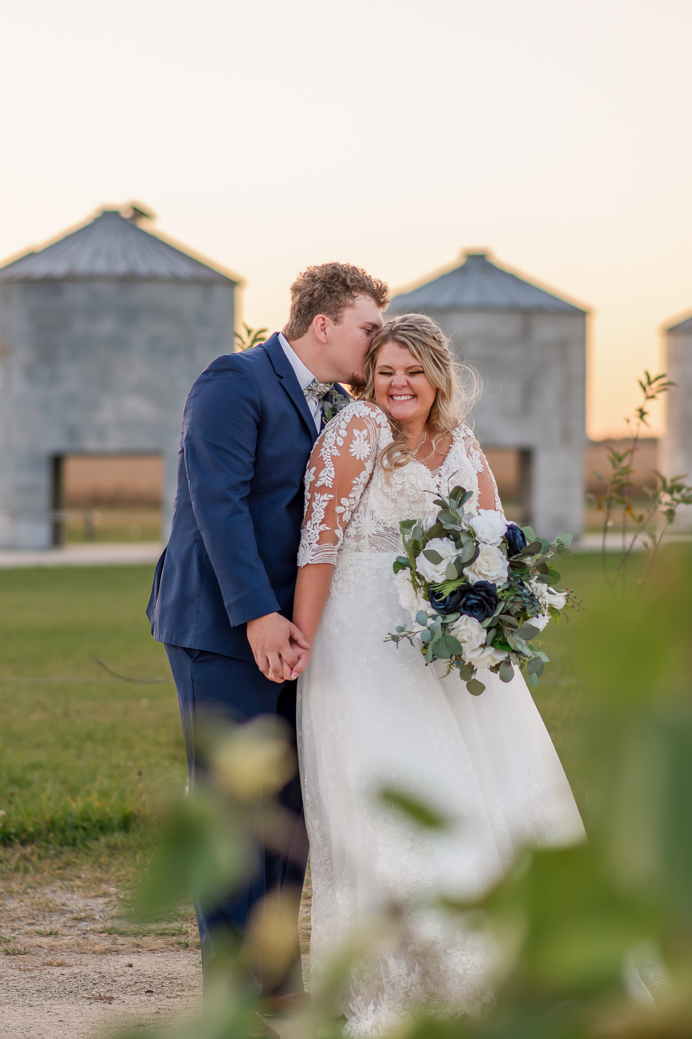 photo of bride and groom laughing on wedding day