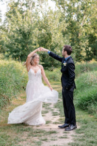 bride and groom twirling on their wedding day