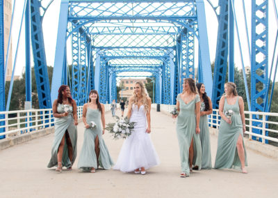 photo of bride walking with her bridesmaids on wedding day