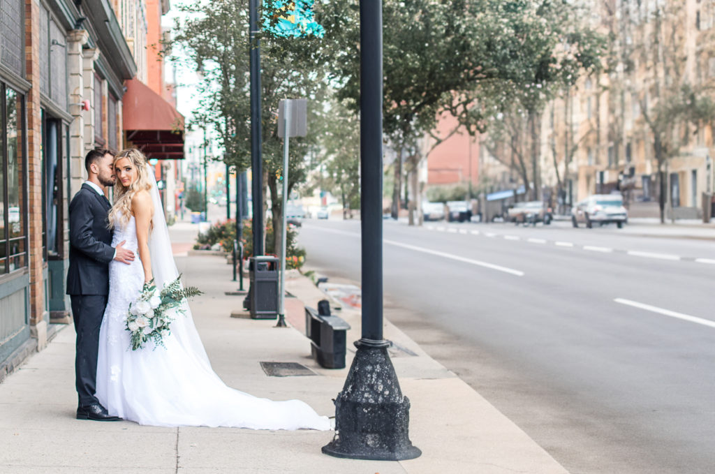 photo of bride and groom posing on wedding day