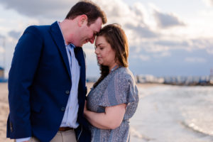 portrait of couple on the beach during engagement session