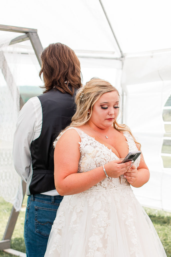 photo of bride reading vows before wedding ceremony