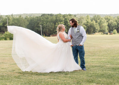 photo of bride and groom looking at each other during portraits on wedding day