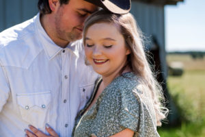 bride and groom pose during engagement session