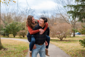 photo of couple piggyback during engagement session