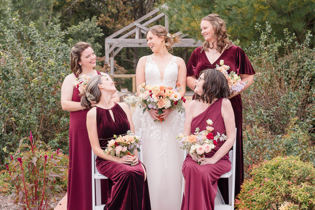 photo of bride with her bridesmaids at weddng