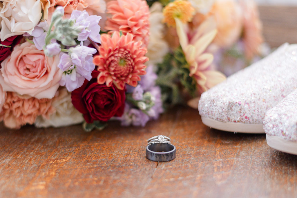 photo of bridal bouquet, rings and shoes