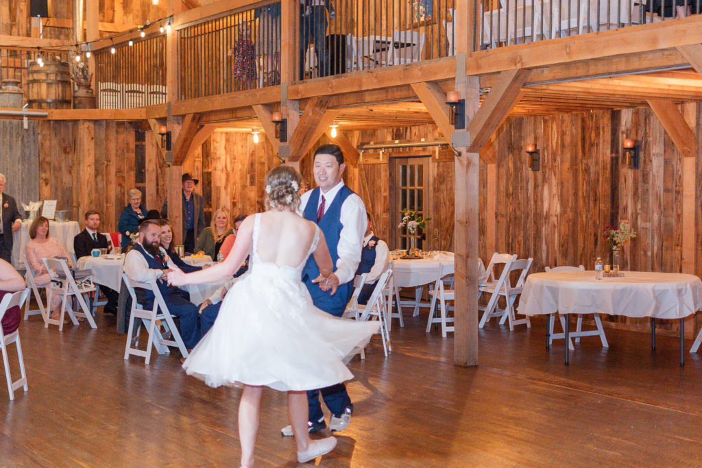 photo of bride and groom swing dancing