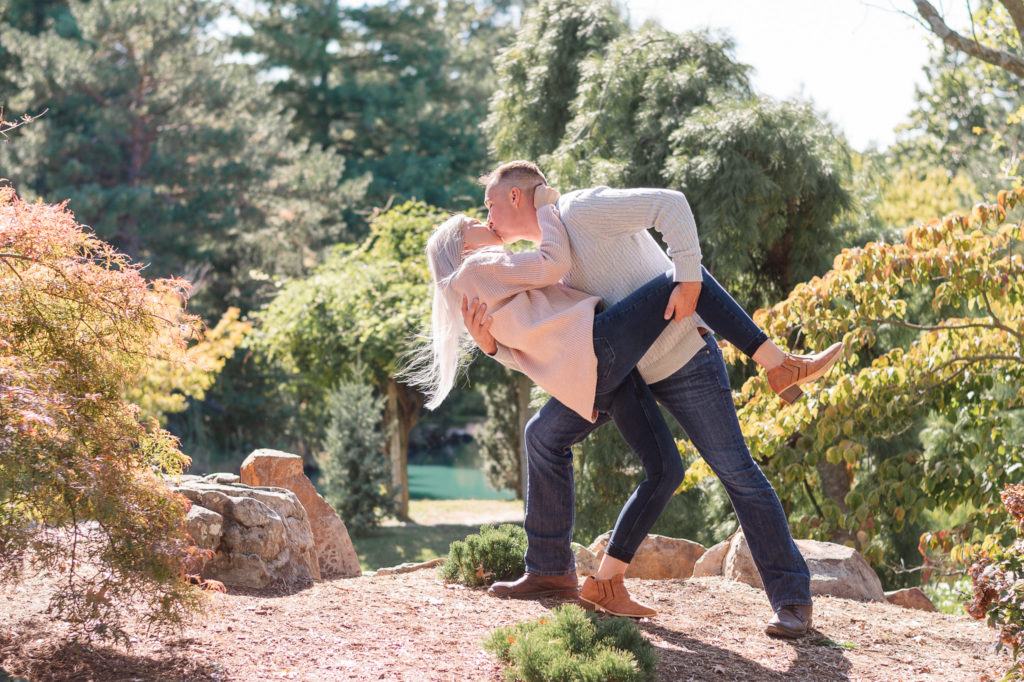 photo of couple dipping and kissing during engagement session