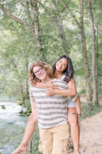 photo of couple piggyback during engagement session