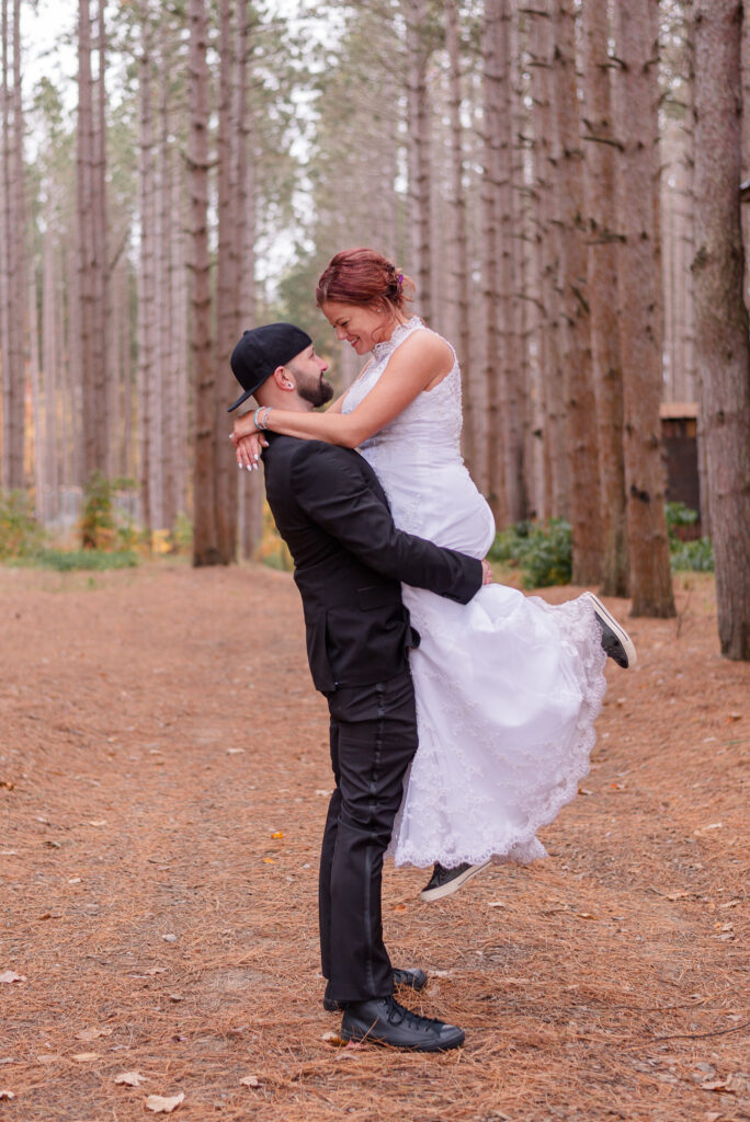 photo of groom holding bride during wedding