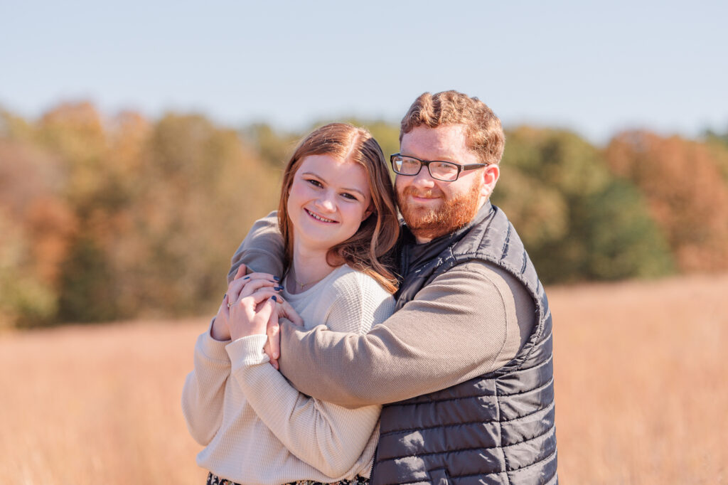 photo of couple smiling during engagement session