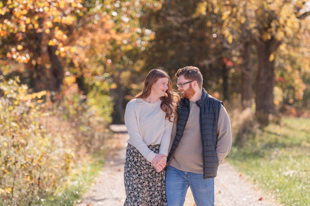 photo of couple smiling at each other in engagement session