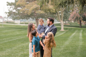 photo of family looking at each other during family session