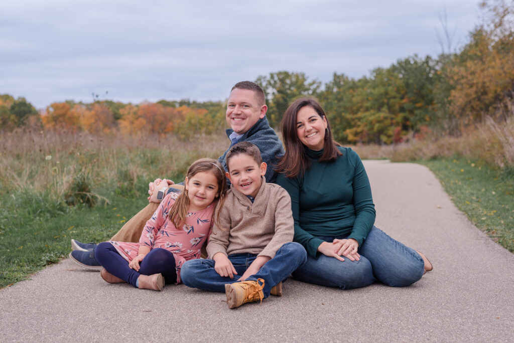 photo of family looking at camera during family photo session