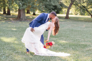 photo of couple kissing and dipping at a wedding